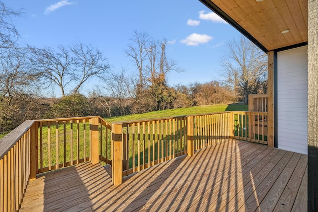 wooden deck with a lawn