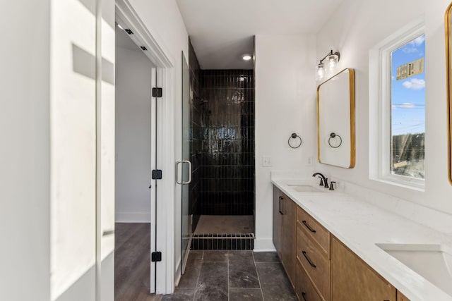 bathroom featuring tile patterned flooring, vanity, and an enclosed shower