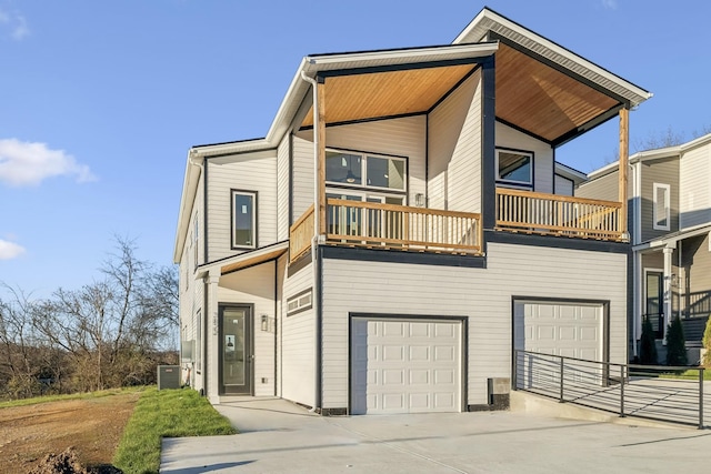 view of front of house with a balcony and a garage