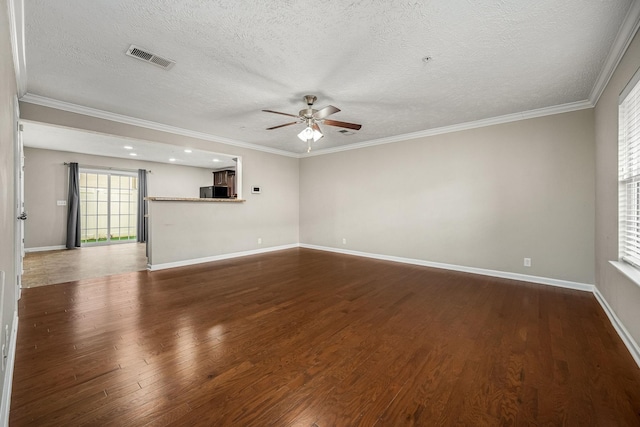 empty room featuring hardwood / wood-style flooring, ceiling fan, and crown molding