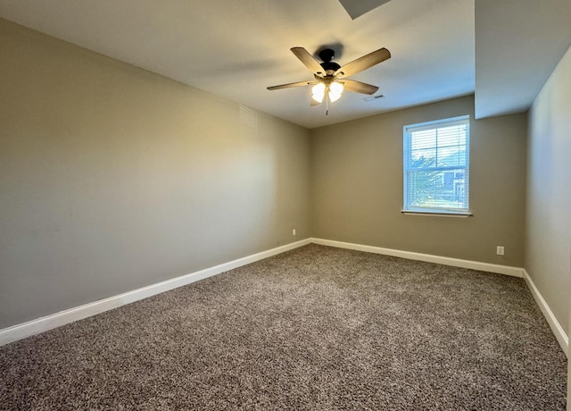 empty room with carpet floors and ceiling fan