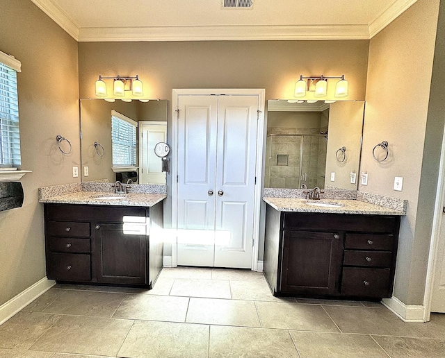 bathroom featuring tile patterned floors, a shower with door, vanity, and ornamental molding