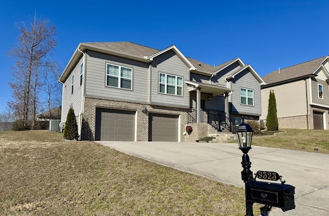 view of front of home with a garage and a front lawn