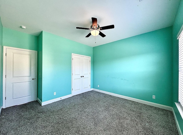 unfurnished bedroom featuring dark colored carpet, ceiling fan, and a closet