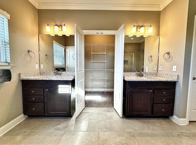 bathroom featuring an enclosed shower, vanity, tile patterned floors, and plenty of natural light