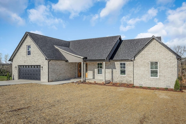 view of front of home with a front lawn and a garage