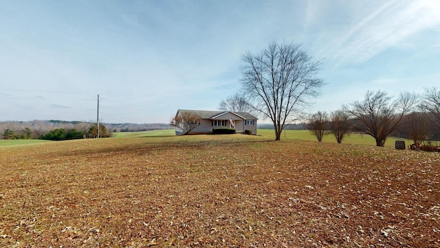 view of yard with a rural view