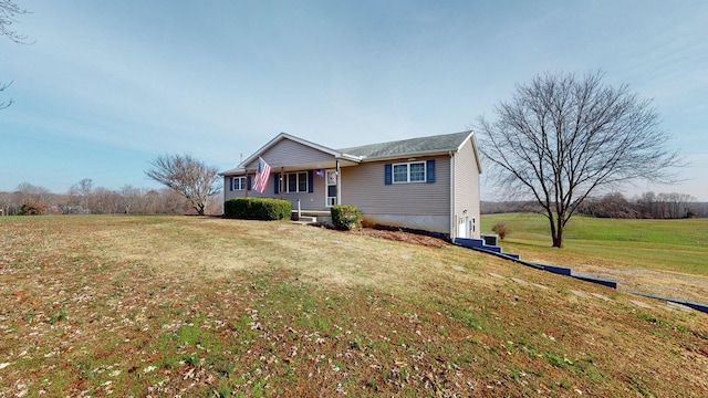 ranch-style house with covered porch and a front yard