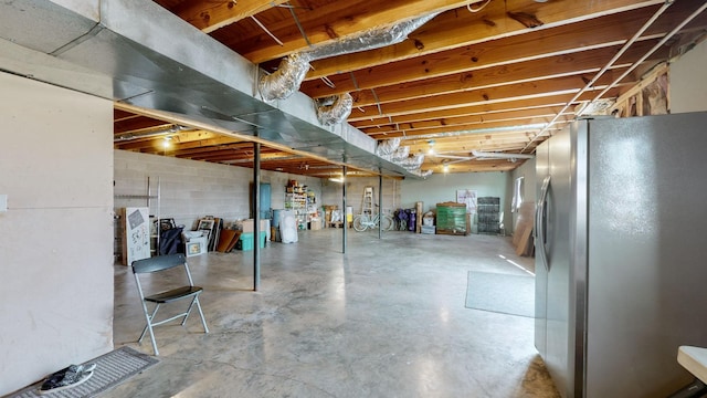 basement with stainless steel fridge