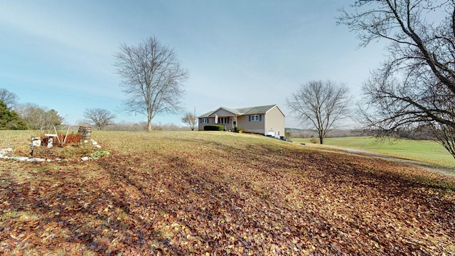 view of yard with a rural view