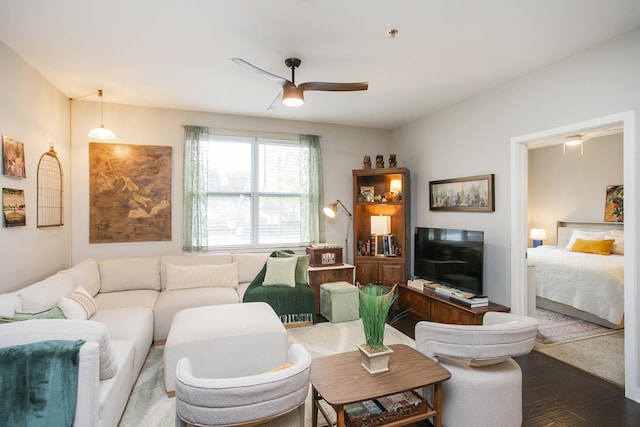 living room with ceiling fan and hardwood / wood-style flooring