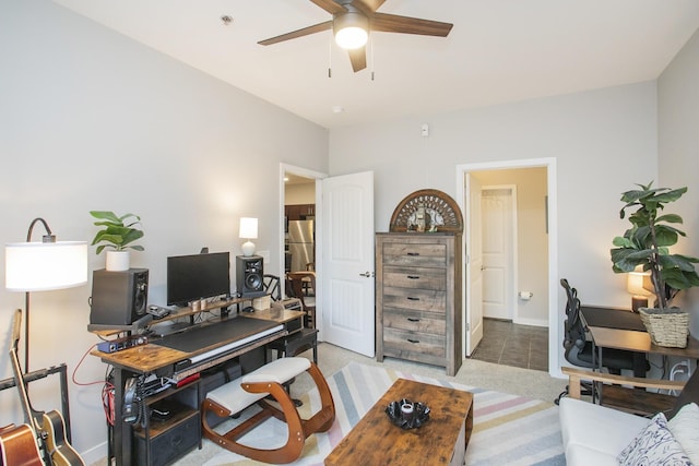 home office with ceiling fan and light tile patterned floors