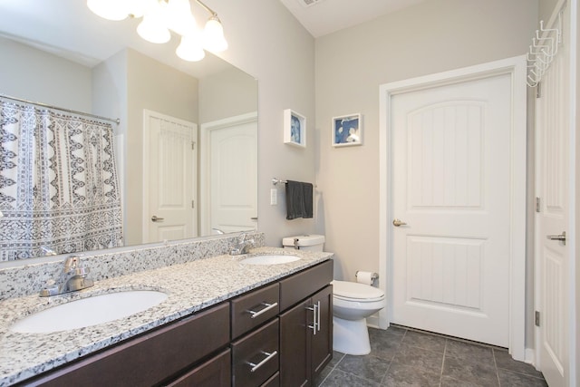 bathroom with vanity, toilet, and a chandelier