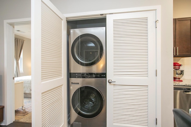 washroom with stacked washer and dryer