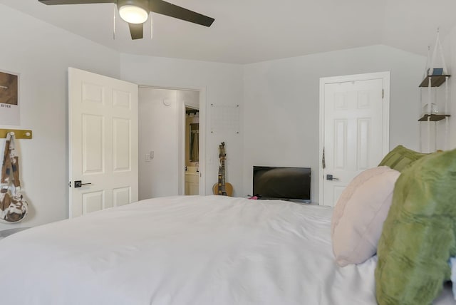 bedroom with ensuite bath and ceiling fan