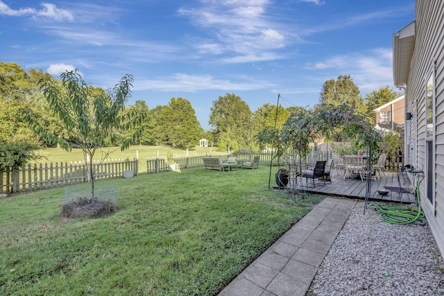 view of yard featuring a wooden deck