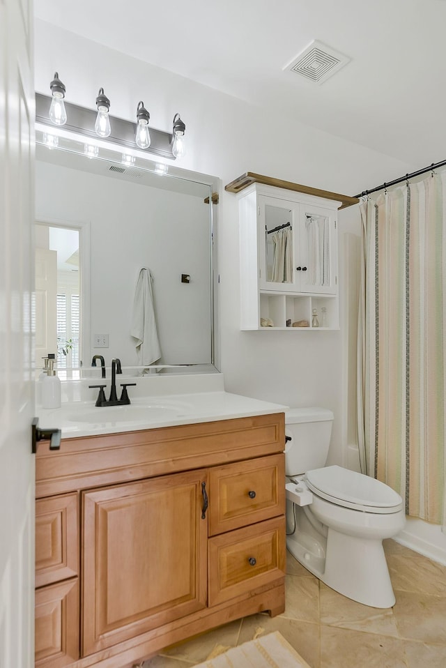 full bathroom featuring toilet, shower / bath combo, vanity, and tile patterned floors