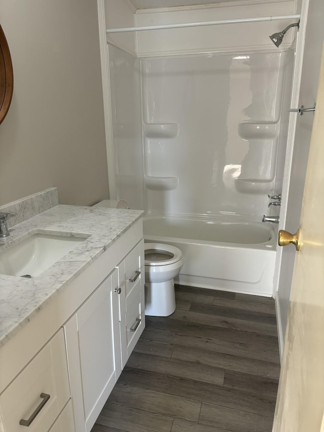 full bathroom with toilet, vanity, shower / bath combination, and hardwood / wood-style flooring