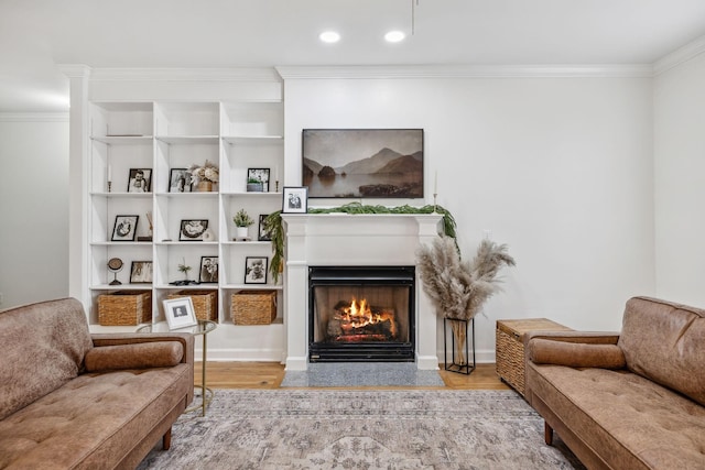 living room featuring hardwood / wood-style flooring and ornamental molding