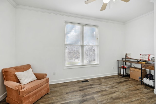 sitting room featuring ornamental molding, dark hardwood / wood-style floors, and ceiling fan