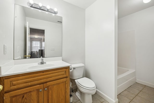 bathroom featuring vanity, tile patterned floors, and toilet