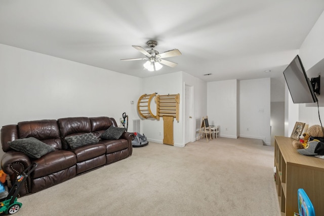 carpeted living room with ceiling fan