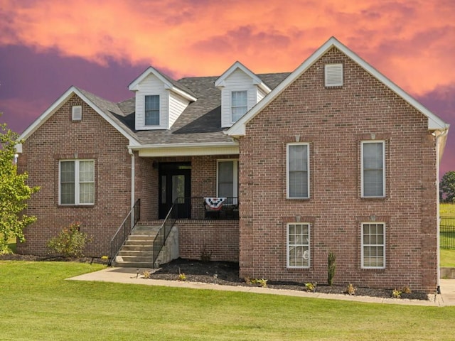 view of front of home featuring a lawn