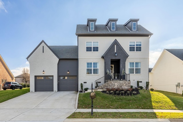 view of front of home featuring a garage and a front lawn