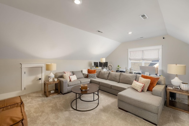 carpeted living room with lofted ceiling