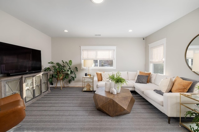 living room featuring a wealth of natural light