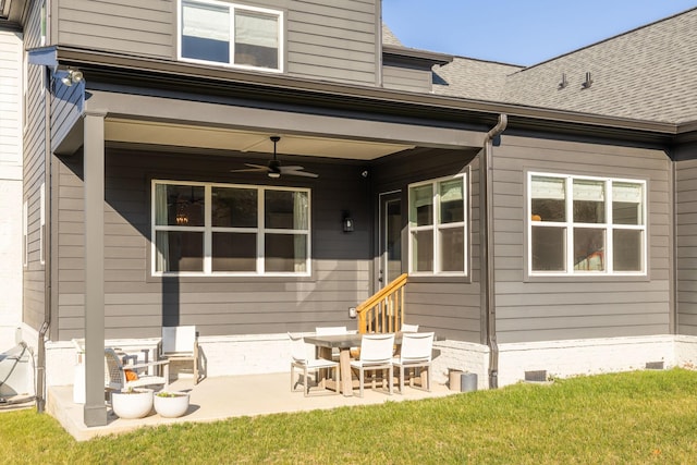 rear view of property with a patio, ceiling fan, and a lawn