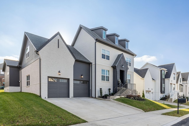 view of front of house with a garage and a front lawn