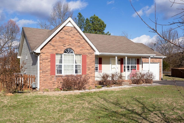 ranch-style home featuring a porch, a garage, and a front lawn