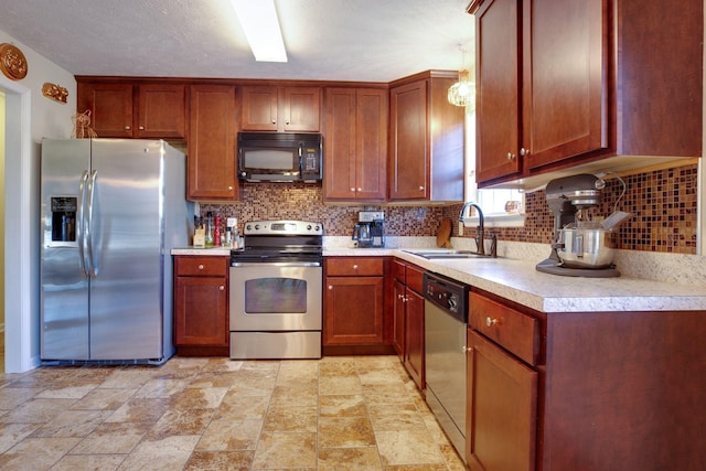 kitchen featuring backsplash, stainless steel appliances, and sink