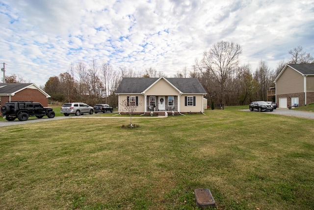 view of front facade featuring covered porch and a front lawn