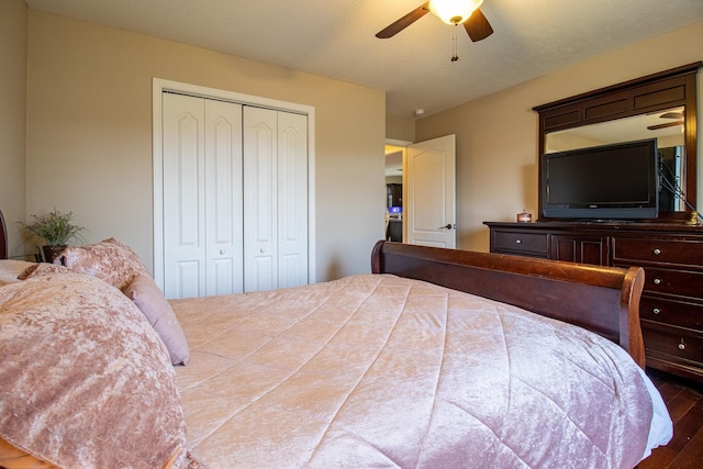 bedroom featuring a closet, ceiling fan, and dark wood-type flooring