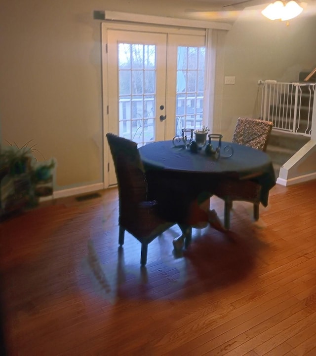 dining room featuring french doors and hardwood / wood-style flooring