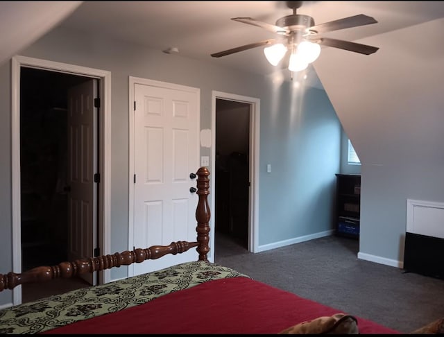 bedroom with dark colored carpet, ceiling fan, and lofted ceiling