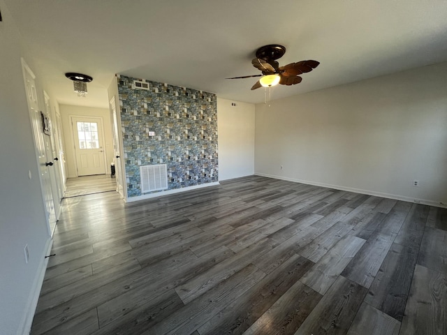 unfurnished room with hardwood / wood-style floors and ceiling fan