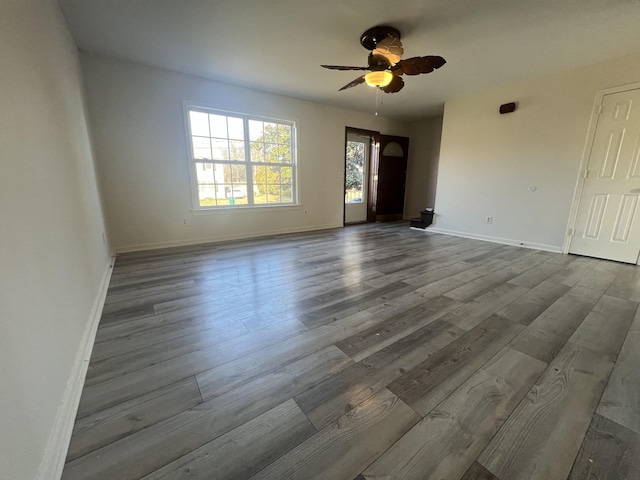 spare room with wood-type flooring and ceiling fan