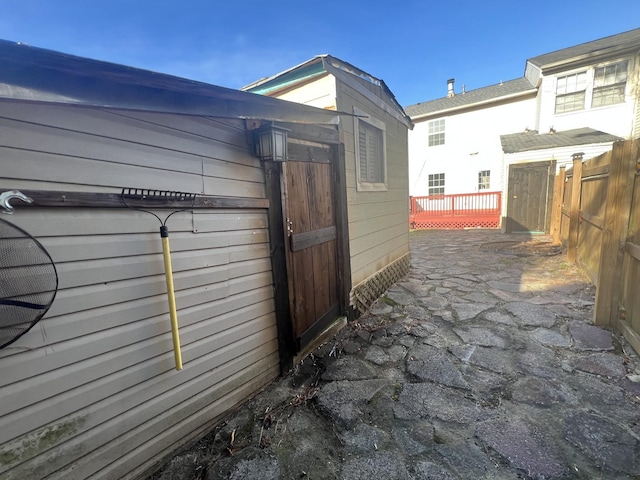 view of side of property with a wooden deck