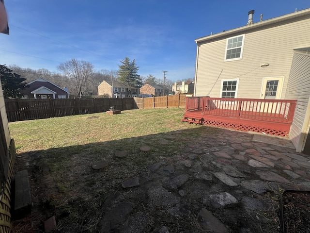 view of yard with a wooden deck and a patio area