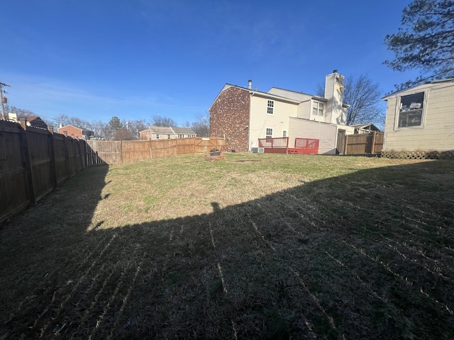 view of yard with a wooden deck