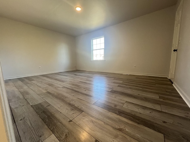 empty room featuring hardwood / wood-style flooring