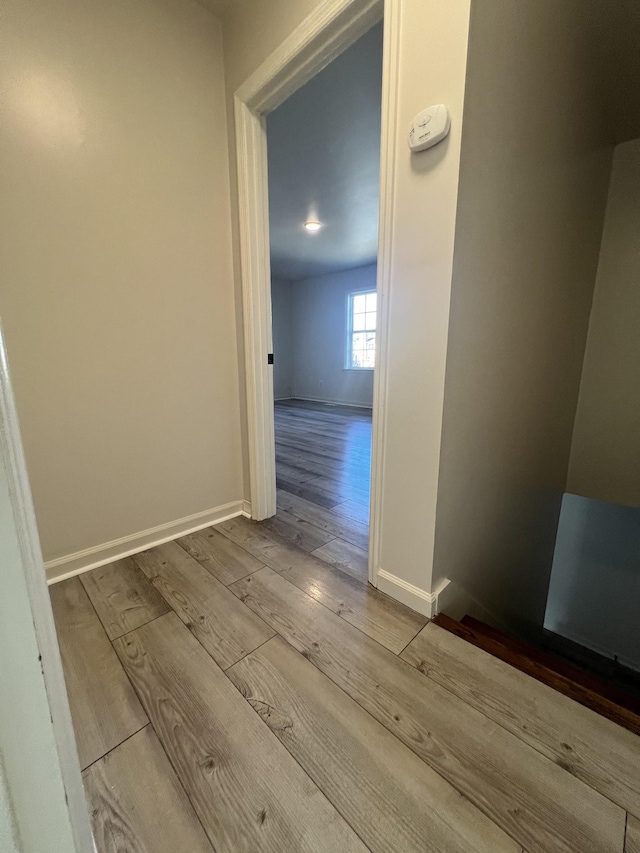 hall with light hardwood / wood-style floors