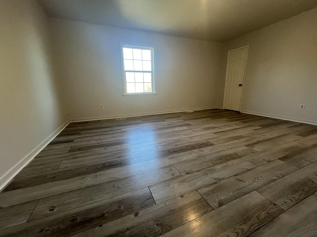 spare room with hardwood / wood-style flooring