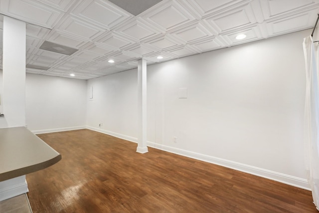 basement with dark wood-type flooring