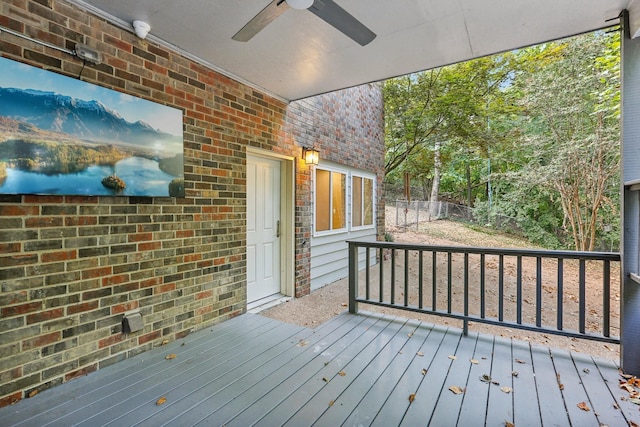 wooden terrace featuring ceiling fan