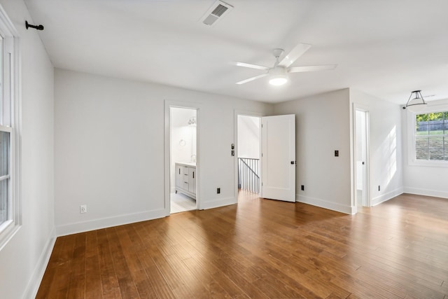 empty room with wood-type flooring and ceiling fan