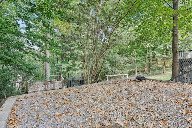 view of yard with a fire pit